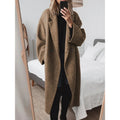 Stijlvolle oversized damesjas met notched lapels en dubbele knopen. 3
