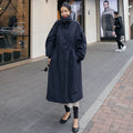 Stijlvol oversized damesjas met ballonmouwen en trekkoord taille.