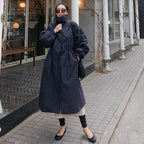 Stijlvol oversized damesjas met ballonmouwen en trekkoord taille. 2