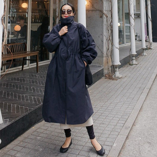 Stijlvol oversized damesjas met ballonmouwen en trekkoord taille. 2