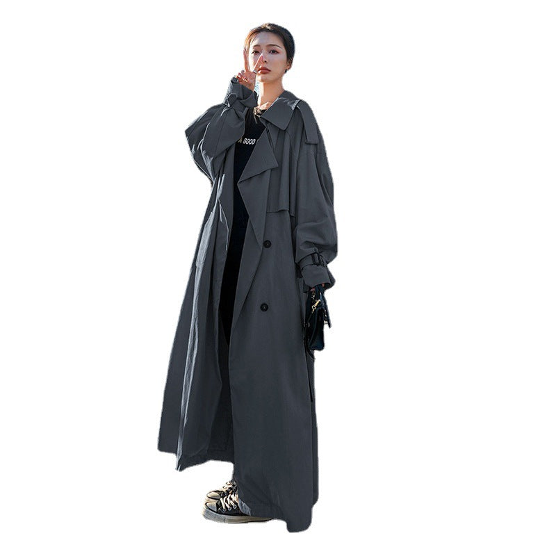 Dames oversized trenchcoat met ballonmouwen en een tailleband in khaki kleur. 3