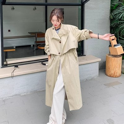 Dames oversized trenchcoat met cape rug en taillekoord in beige-apricot 4