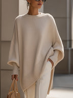 Dames poncho-strickpullover met fledermausärmeln in elegante stijl.