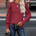 Dames pullover met gestructureerde mouwen in bordeaux kleur.