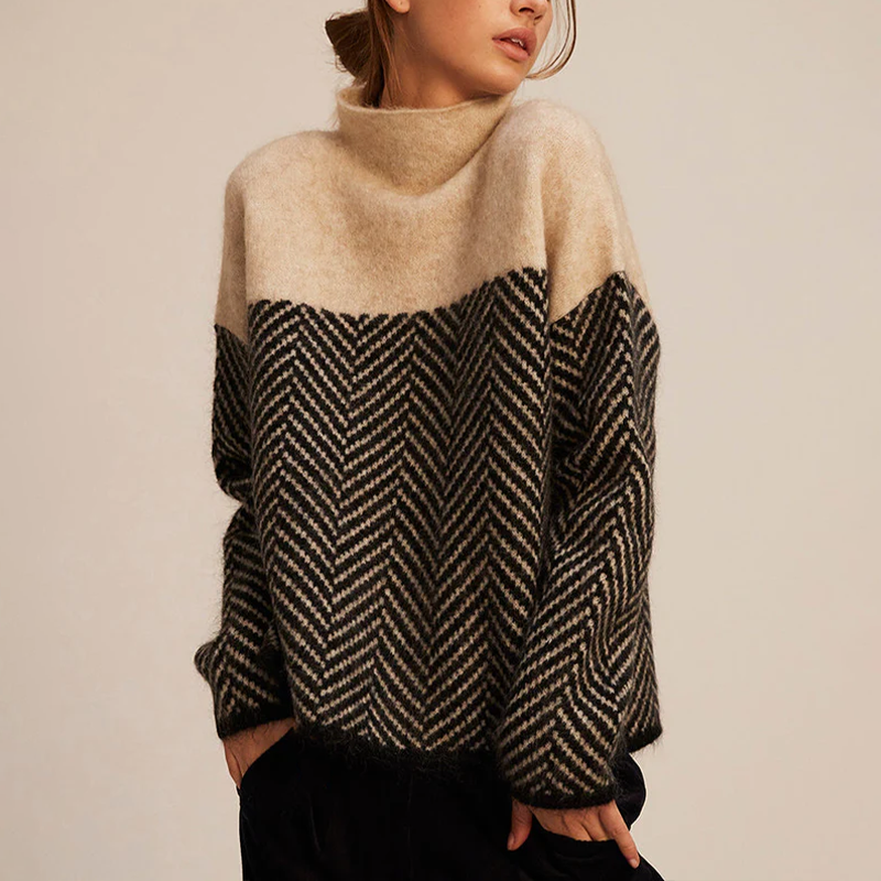 Dames rollkragenpullover met visgraatpatroon in stijlvol ontwerp.