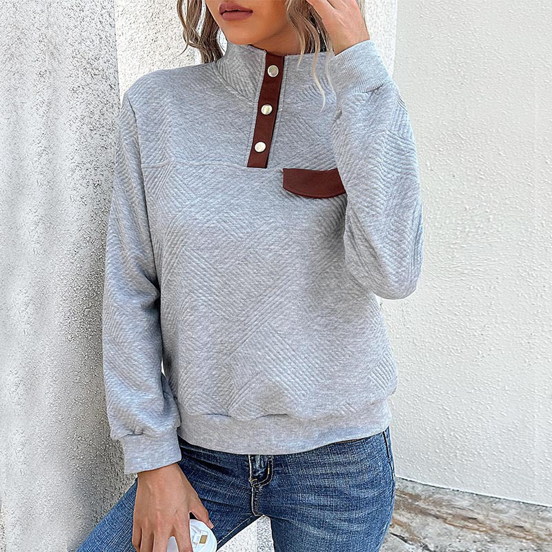 Elegante dames rollkragenpullover met knopfdetails in blauw.