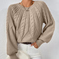Dames strickpullover met zopfpatroon in beige kleur.