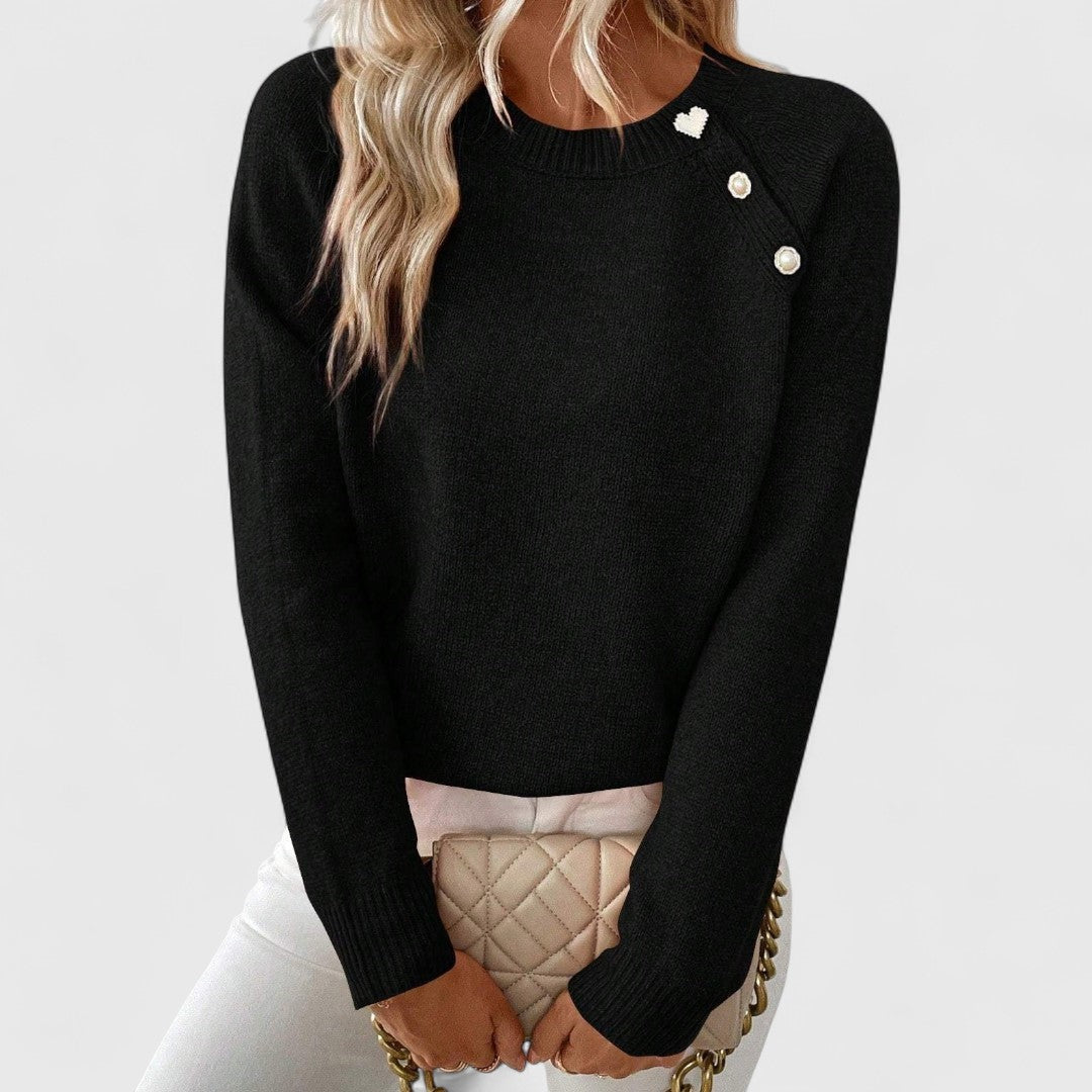 Dames strickpullover met perlenknopfdetail in elegante stijl.