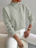 Dames strickpullover met staande kraag in verschillende kleuren.