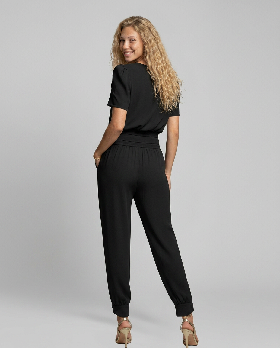 Erma V-Neck Jumpsuit met elastische taille in zwart, groen, blauw en geel. 2