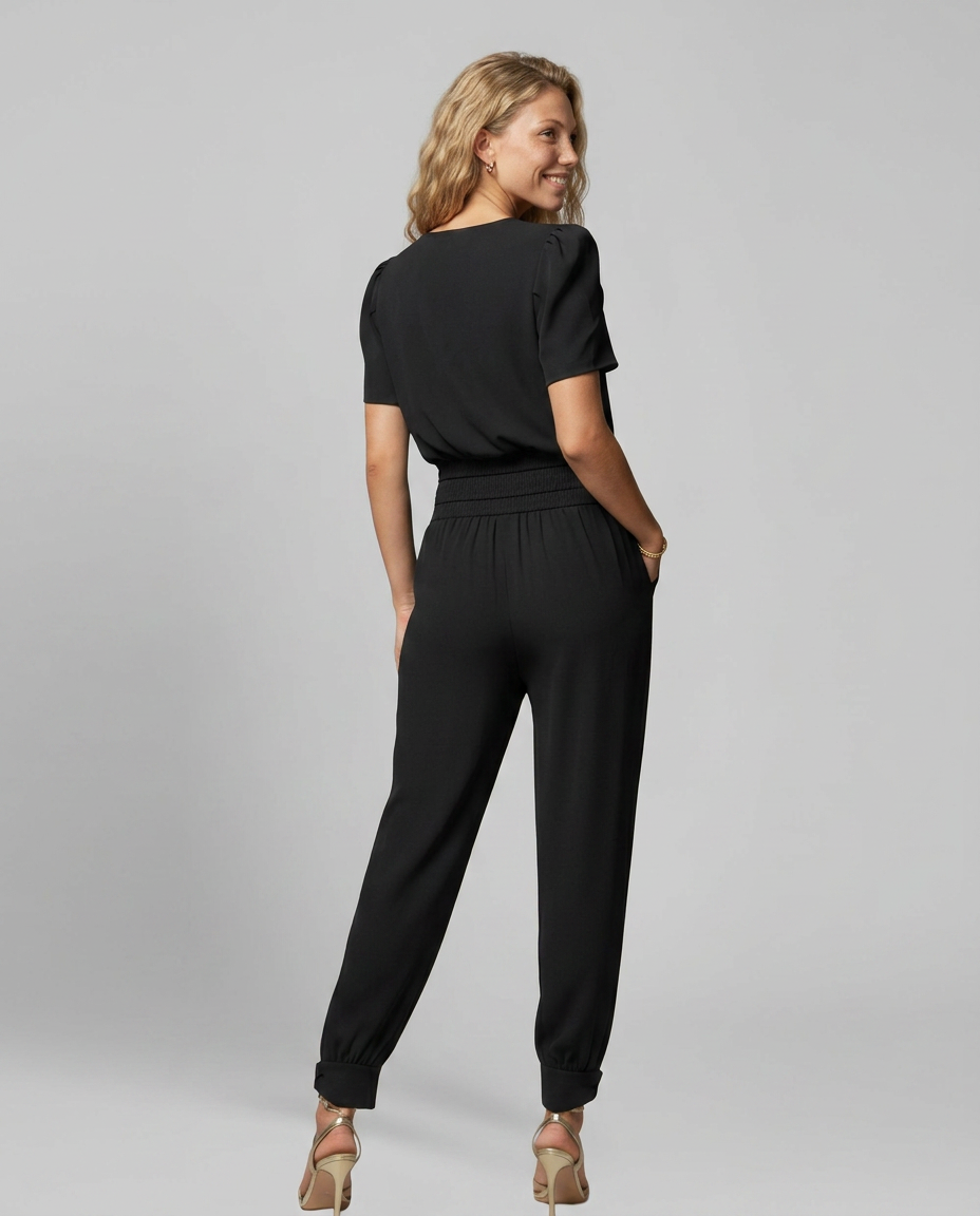 Erma V-Neck Jumpsuit met elastische taille in zwart, groen, blauw en geel. 3