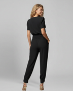 Erma V-Neck Jumpsuit met elastische taille in zwart, groen, blauw en geel. 3