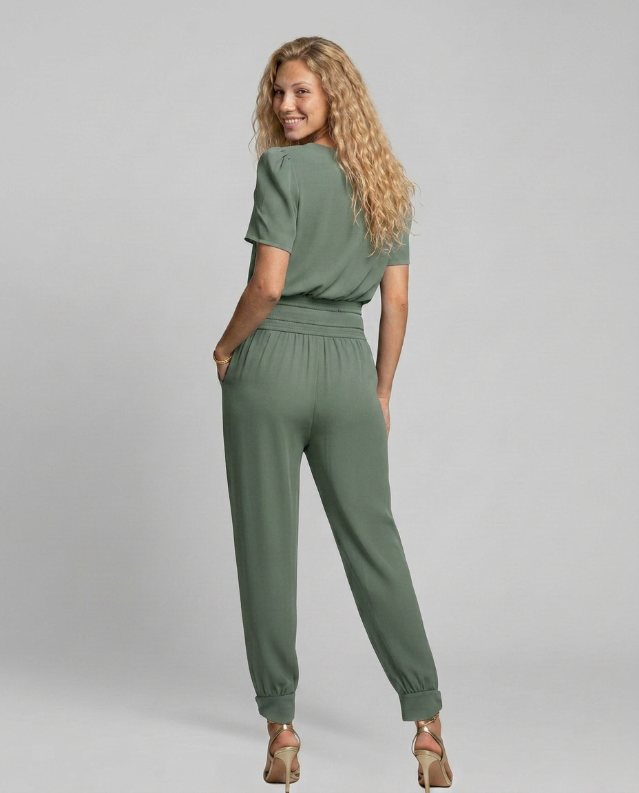 Erma V-Neck Jumpsuit met elastische taille in zwart, groen, blauw en geel. 5