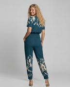 Erma V-Neck Jumpsuit met elastische taille in zwart, groen, blauw en geel. 7