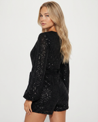 Glinsterende Kathy romper met wikkelvoorkant in zwart en roze. 2